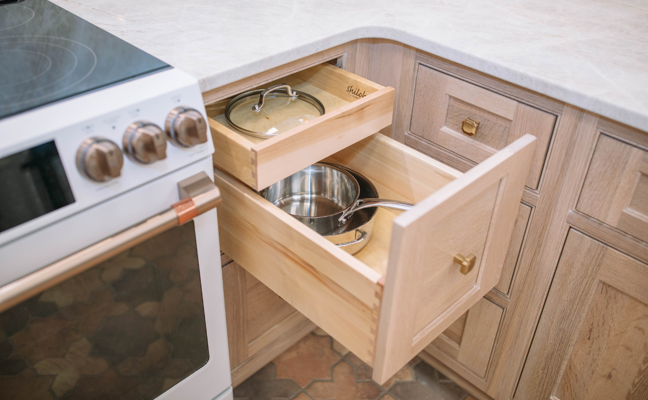 off white cabinets with gold hardware in bathroom
