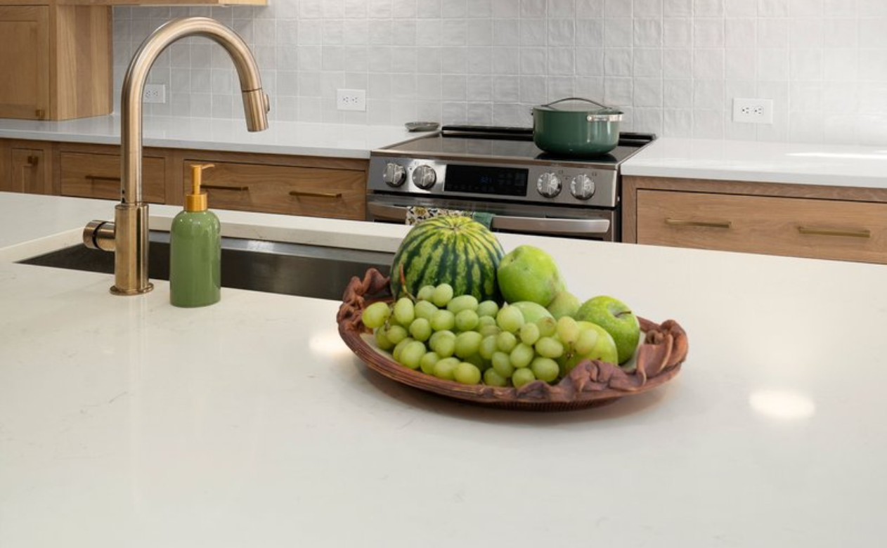 grey quartz countertops in modern white kitchen